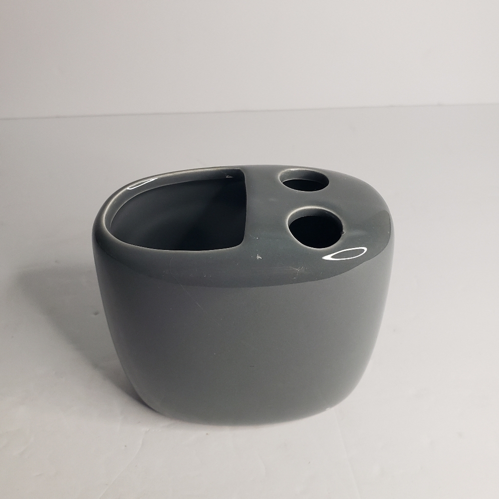 Ceramic toothbrush and toothpaste holder. 171